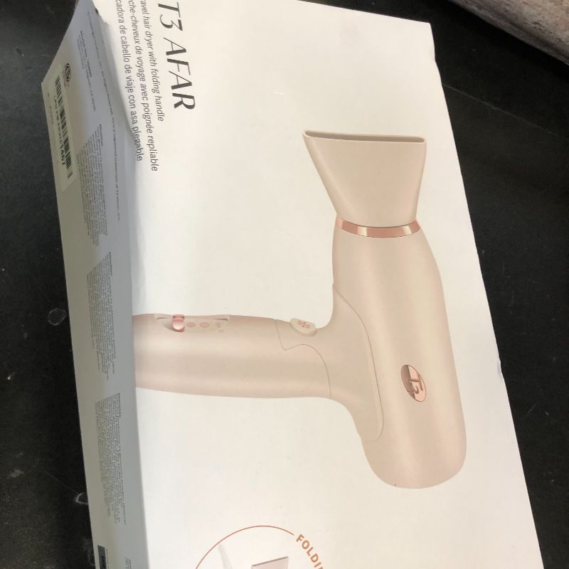 Photo 1 of T3 Afar Lightweight Travel-Size Hair Dryer with Auto Dual Voltage, Folding Handle, Fast Drying, Lightweight and Ergonomic, Frizz Smoothing, Multiple Heat and Speed Combinations
