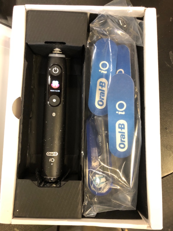 Photo 1 of Oral-B iO Series 10 Rechargeable Electric Toothbrush with Visible Pressure Sensor to Protect Gums, 2 Min Timer, 7 Cleaning Settings, 4 Replacement Toothbrush Heads, and Charging Travel Case, Black