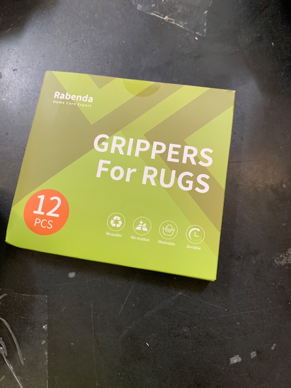 Photo 1 of Rabenda 12 Pcs Rug Tape, Non Slip Rug Pads Grippers for Hardwood Floors and Tiles, Reusable Carpet Tape for Area Rugs, Double-Sided Adhesive Rug Stickers Keep Corners Flat (Black)