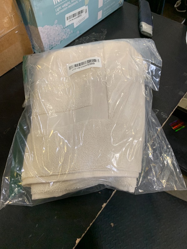 Photo 1 of Amazon Basics Banded Bathroom Bath Rug Mat, Cream, 31" L x 20" W