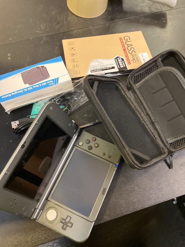 Photo 1 of Nintendo New 3DS XL, Black Premium Bundle (Renewed)