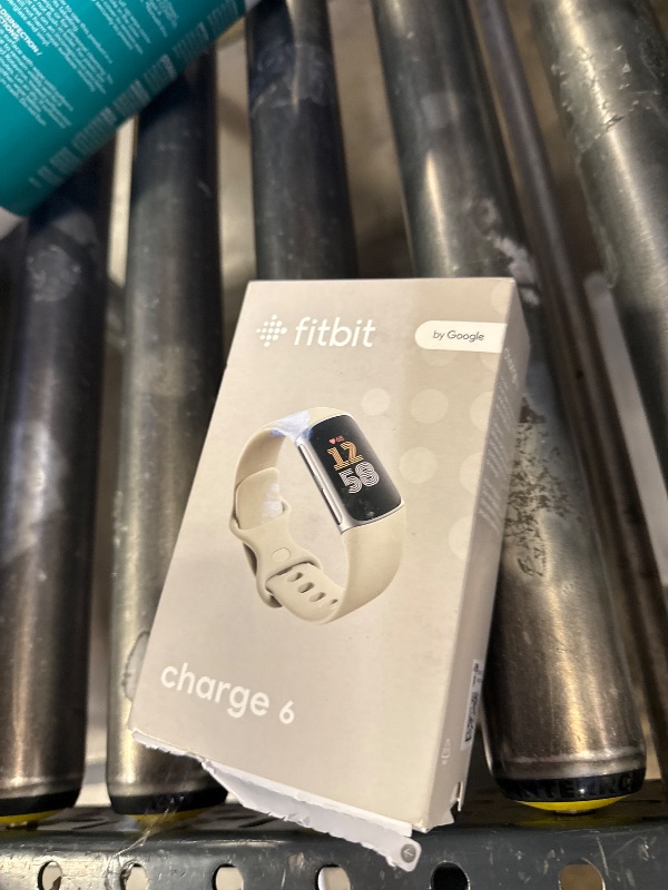 Photo 1 of Fitbit Charge 6 Fitness Tracker with Google apps, Heart Rate on Exercise Equipment, 6-Months Premium Membership Included, GPS, Health Tools and More, Porcelain/Silver, One Size (S & L Bands Included)