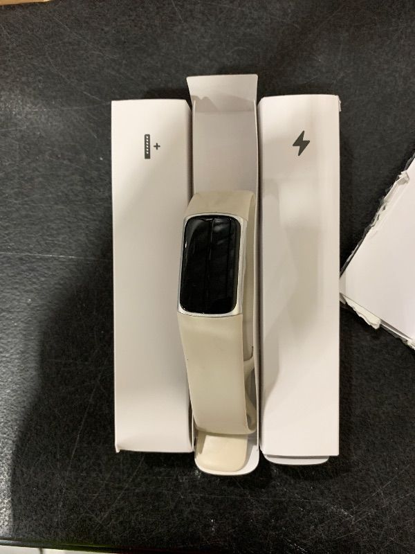 Photo 1 of MISSING CHARGER ------------------------Fitbit Charge 6 Fitness Tracker with Google apps, Heart Rate on Exercise Equipment, 6-Months Premium Membership Included, GPS, Health Tools and More, Porcelain/Silver, One Size (S & L Bands Included)