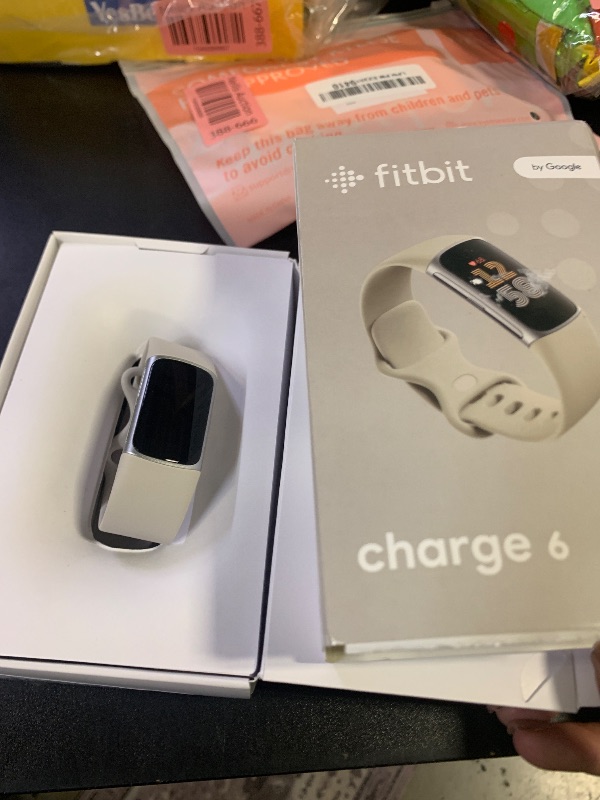 Photo 1 of Fitbit Charge 6 Fitness Tracker with Google apps, Heart Rate on Exercise Equipment, 6-Months Premium Membership Included, GPS, Health Tools and More, Porcelain/Silver, One Size (S & L Bands Included)