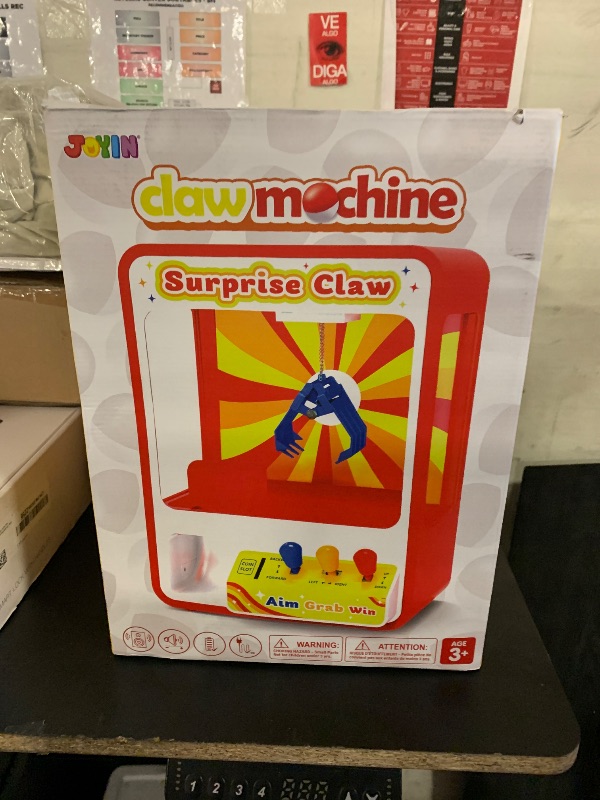 Photo 1 of JOYIN Claw Machine Arcade Toy with LED Light & Adjustable Sound, Rechargable Dispenser Toys Mini Vending Machine for Kids - Perfect Christmas & Birthday Big Gifts for Kids, Ages 3+