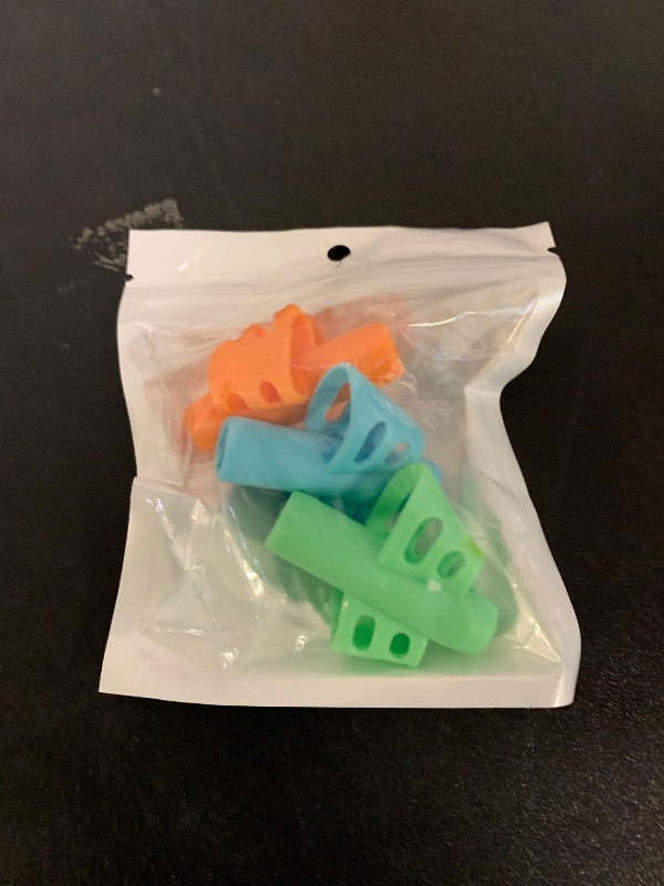 Photo 1 of JuneLsy Pencil Grips for Kids Handwriting Pencil gripper Pencil Holder Posture Correction Training Writing AIDS for preschooler Kids toddler Children Special Needs (3 PCS)