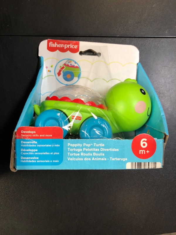 Photo 1 of Fisher-Price Baby Crawling Toy Poppity Pop Turtle Push-Along Vehicle with Ball Popping Sounds for Infants Ages 6+ Months?