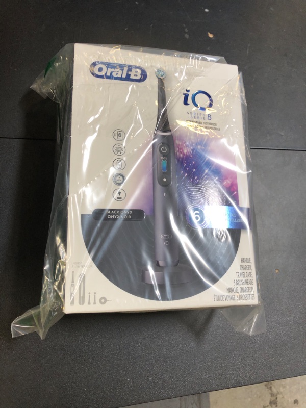 Photo 1 of Oral-B iO Series 8 Electric Toothbrush with 2 Replacement Brush Heads and Travel Case, Rechargeable Toothbrush, Black Onyx
