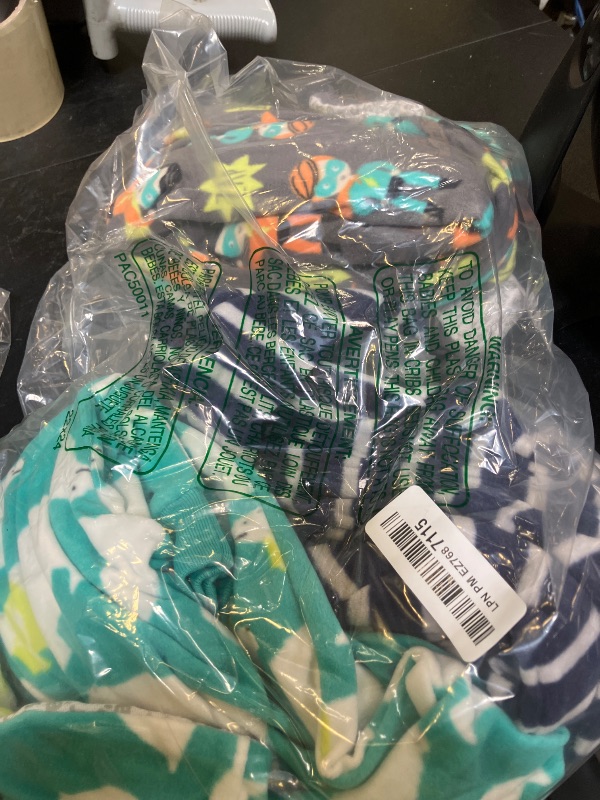 Photo 1 of Simple Joys by Carter's Baby Boys' 3-Pack Loose Fit Flame Resistant Fleece Footed Pajamas, Charcoal Superhero/Green Polar Bear/Navy Tiger, 24 Months