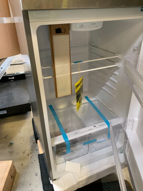 Photo 1 of Frigidaire 10.1 Cu. Ft. Compact ADA Top Freezer Refrigerator in Brushed Steel with Electronic Control Panel, Reversible Door Swing, ENERGY STAR