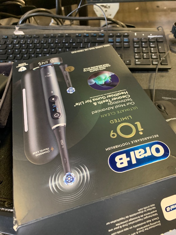 Photo 1 of Oral-B Rechargeable Electric Toothbrush, iO9 Limited Ultimate Clean, 7 Cleaning Modes, Interactive Display, iSense Charger, Charging Travel Case, Visible Pressure Sensor, 3 Brush Heads, Black