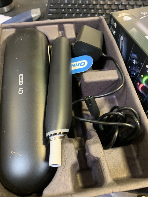 Photo 1 of Oral-B Rechargeable Electric Toothbrush, iO9 Limited Ultimate Clean, 7 Cleaning Modes, Interactive Display, iSense Charger, Charging Travel Case, Visible Pressure Sensor, 3 Brush Heads, Black