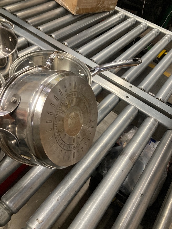 Photo 1 of ***ONLY THE 3 POTS WITH LIDS AND STRAINER/NOT IN ORIGINAL PACKAGE-USED***T-fal Stainless Steel Cookware Set, 11 Piece, Induction Cookware, Oven Safe to 500°F, Kitchen Cooking Set w/Fry Pans, Pots and Pans, Dutch Oven, Saucepans, Kitchen Essentials, Silver