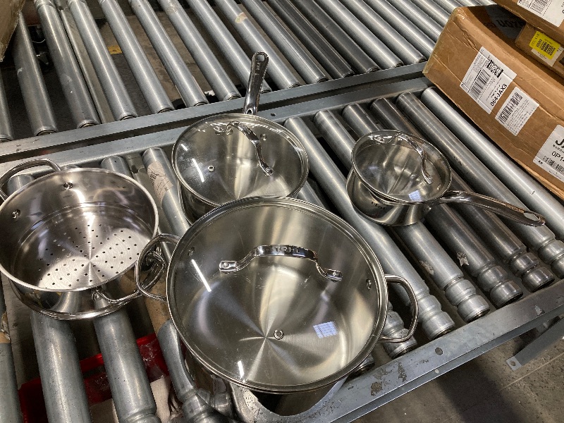 Photo 1 of ***ONLY THE 3 POTS WITH LIDS AND STRAINER/NOT IN ORIGINAL PACKAGE-USED***T-fal Stainless Steel Cookware Set, 11 Piece, Induction Cookware, Oven Safe to 500°F, Kitchen Cooking Set w/Fry Pans, Pots and Pans, Dutch Oven, Saucepans, Kitchen Essentials, Silver