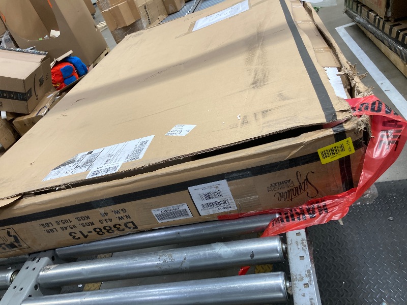 Photo 1 of *Damaged corner to table* Signature Design by Ashley Caitbrook Rustic Counter Height Dining Table with Storage, Dark Gray