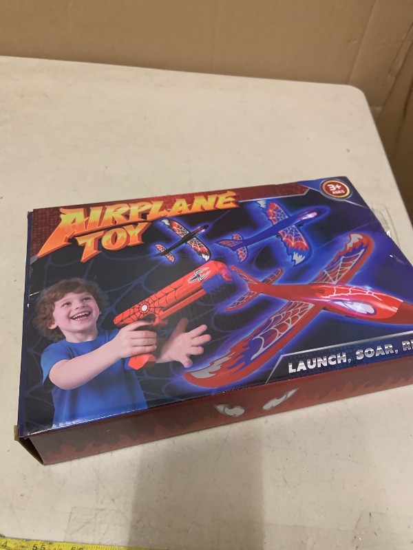 Photo 1 of 3 Pack Airplane Launcher Toy with Glowing Eyes & Web-Pattern Wings,2 Flight Modes Outdoor Games for Kids,Boys Toys Age 3-12,Birthday Gifts for 3 4 5 6 7 8 9 10 11 12 Year Old,Kids Gift(Red&Blue&Black)