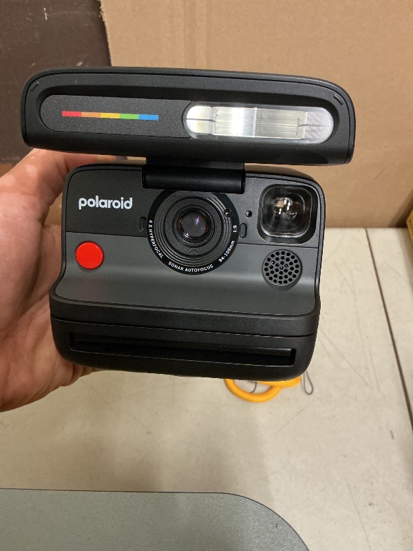 Photo 1 of Polaroid Flip Instant Camera + Color Film Bundle (16 Photos Included) - Black (6565) - Hyperfocal 4-Lens System, Sonar autofocus, and Sence Analysis with Bluetooth paired Companion app