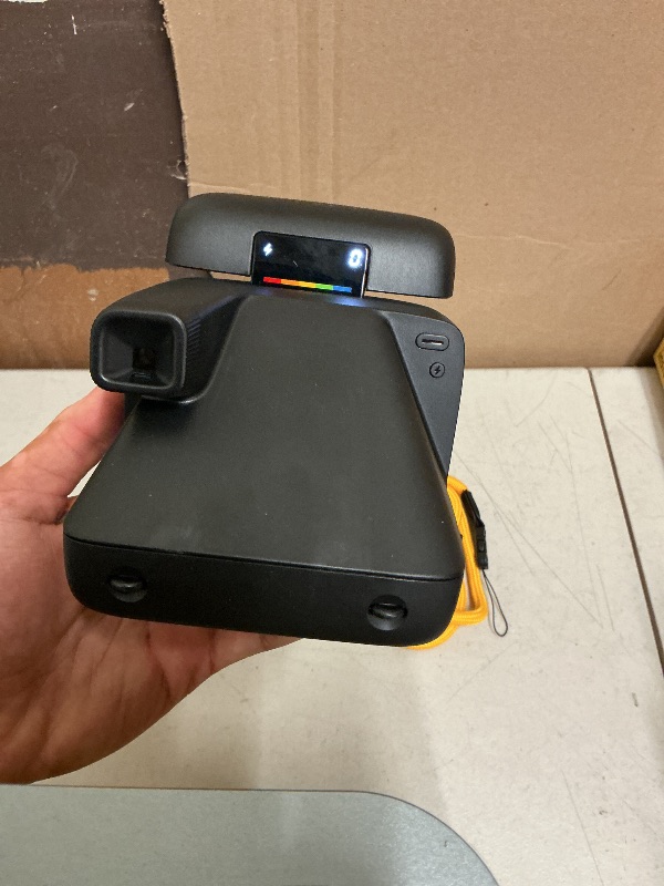 Photo 1 of Polaroid Flip Instant Camera + Color Film Bundle (16 Photos Included) - Black (6565) - Hyperfocal 4-Lens System, Sonar autofocus, and Sence Analysis with Bluetooth paired Companion app