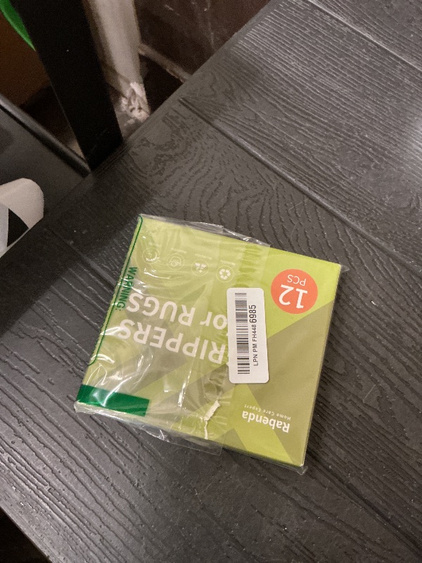 Photo 1 of Rabenda 12 Pcs Rug Tape, Non Slip Rug Pads Grippers for Hardwood Floors and Tiles, Reusable Carpet Tape for Area Rugs, Double-Sided Adhesive Rug Stickers Keep Corners Flat (Black)