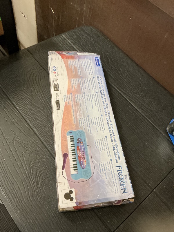 Photo 1 of Lexibook, Frozen, Electronic Keyboard, 32-Keys Piano, Microphone for Singing, 22 Demo Songs, Battery Operated, Blue/Purple, K703FZ