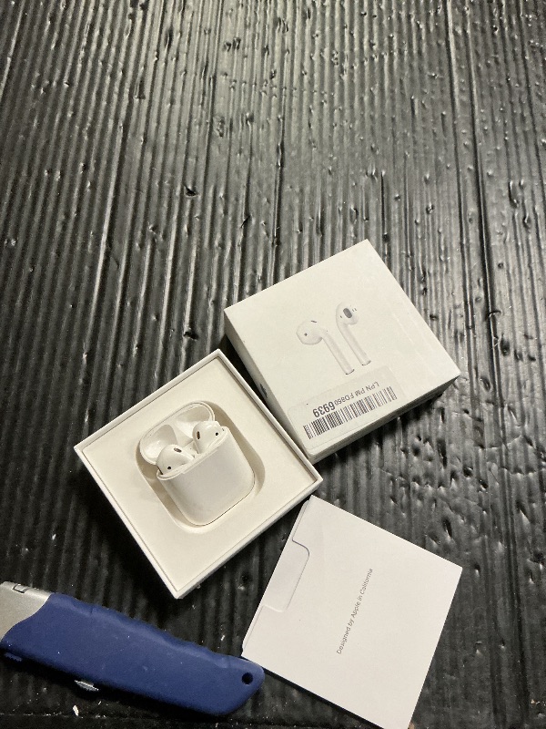 Photo 1 of Apple AirPods Wireless Ear Buds, Bluetooth Headphones with Lightning Charging Case Included, Over 24 Hours of Battery Life, Effortless Setup for iPhone