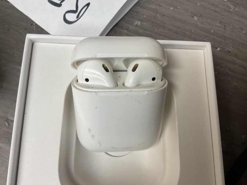 Photo 1 of Apple AirPods Wireless Ear Buds, Bluetooth Headphones with Lightning Charging Case Included, Over 24 Hours of Battery Life, Effortless Setup for iPhone