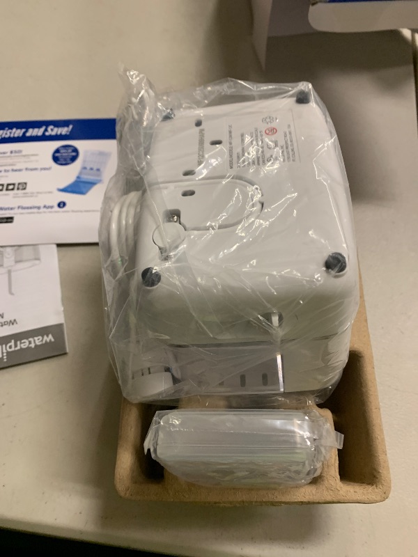 Photo 1 of Waterpik ION Professional Water Flosser, Rechargeable and Portable for Teeth, Gums, Braces, 10 Settings, 7 Flossing Tips For Multiple Users And Needs, ADA Accepted, WF-12 White, Packaging May Vary