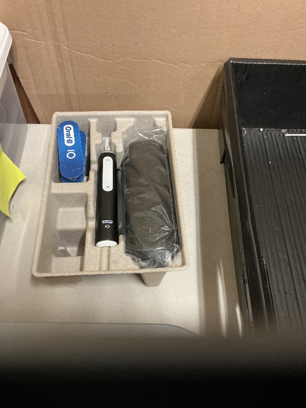 Photo 1 of Oral-B iO Deep Clean Rechargeable Electric Powered Toothbrush, Black with iO Series 3 Limited, 2 Brush Heads and Travel Case - Pressure Sensor to Protect Gums - 3 Cleaning Settings - 2 Minute Timer