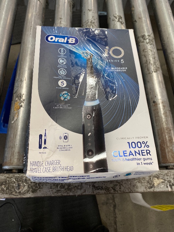 Photo 1 of Oral-B iO Series 5 Rechargeable Electric Toothbrush with Visible Pressure Sensor to Protect Gums, 2 Minute Timer, 5 Cleaning Settings, 1 Replacement Toothbrush Heads, and Travel Case, Black