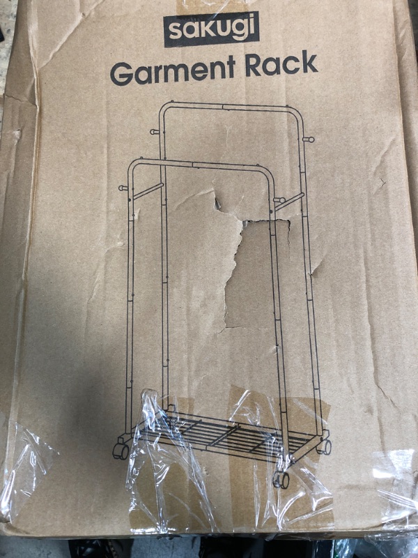 Photo 1 of **MISSING ASSEMBLY PIECES** Sakugi Clothes Rack - Double Rods Clothing Rack with Mesh Shelf, Hooks & Wheels, Metal Clothing Racks for Hanging Clothes & Bags, Multifunctional Garment Rack for Laundry, Black, 28.7" x 16.5" x 59.1"