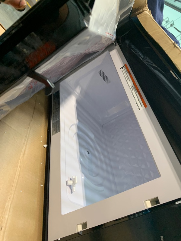 Photo 1 of ** UNTESTED *** BLACK+DECKER Over the Range Microwave Oven with Vent and One-Touch Auto Cooking, 1.7 cu. ft. OTR Over Stove Microwave, Stainless Steel, 1000 Watts, EM044K6CE-SS