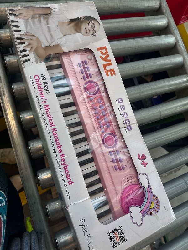 Photo 1 of **USED**
Pyle 49 Key Electric Keyboard Piano, Music Keyboard, Karaoke Fun, Rechargeable Battery, Wired Microphone, 100 Tunes, 50 Demos, Aux Input, Compact Design, (PKBRD4912PK)