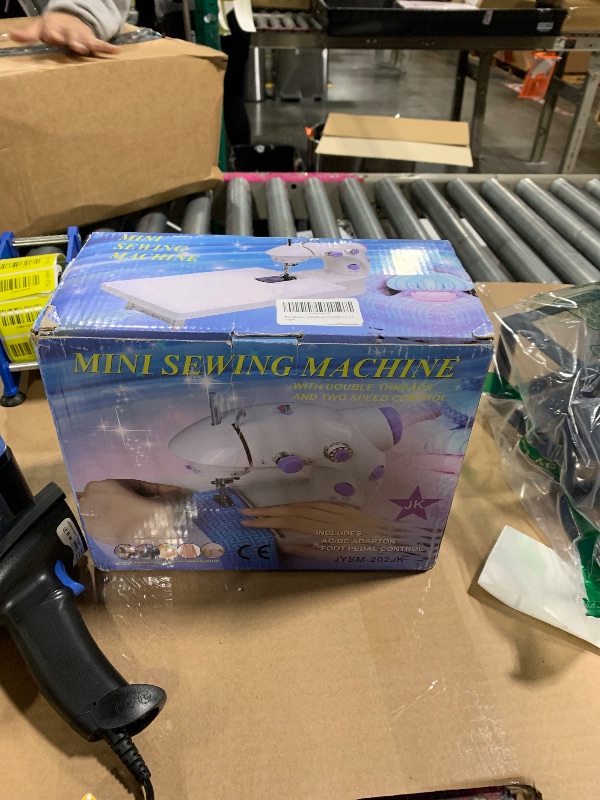 Photo 1 of Sewing Machine, 2 Modes Mini Sewing Machine for Beginners with Extension Table & Light, Portable and Easy to Use for DIY, Clothes, Home and Travel