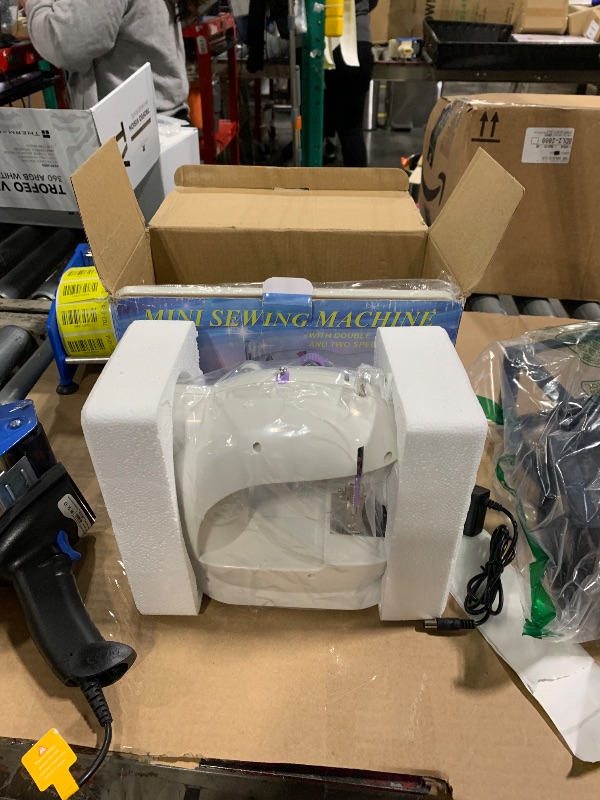 Photo 1 of Sewing Machine, 2 Modes Mini Sewing Machine for Beginners with Extension Table & Light, Portable and Easy to Use for DIY, Clothes, Home and Travel