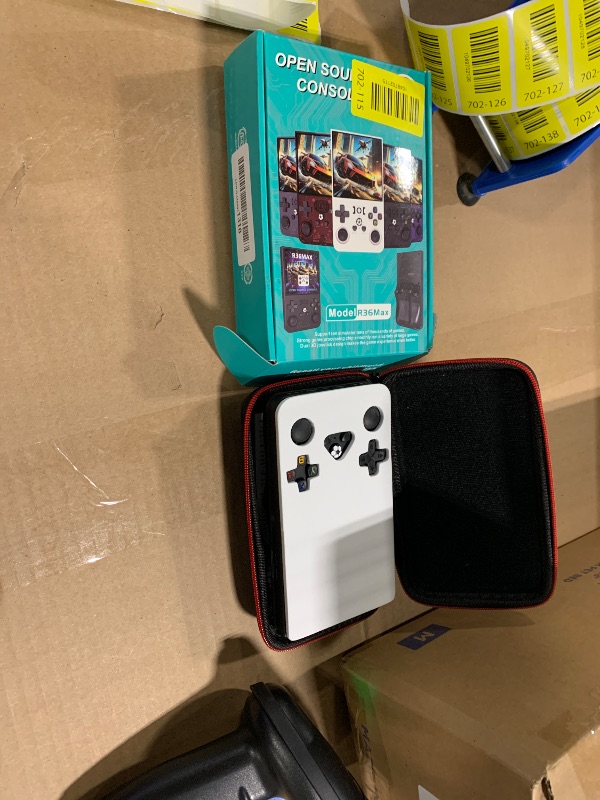Photo 1 of ?R36MAX 4000mAh Portable Rechargeable Handheld Retro Game Console,Comfort Non-Slip Handheld Standing Retro Game Console with 64G TF Car,4.0-inch Screen,for Office,Black