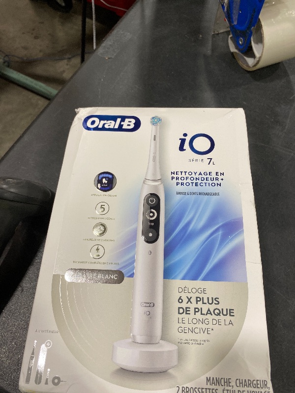 Photo 1 of Oral-B iO Deep Clean + Protect Rechargeable Electric Toothbrush, White with a iO Series 7 Toothbrush, 2 Replacement Brush Heads, and a Charging Travel Case