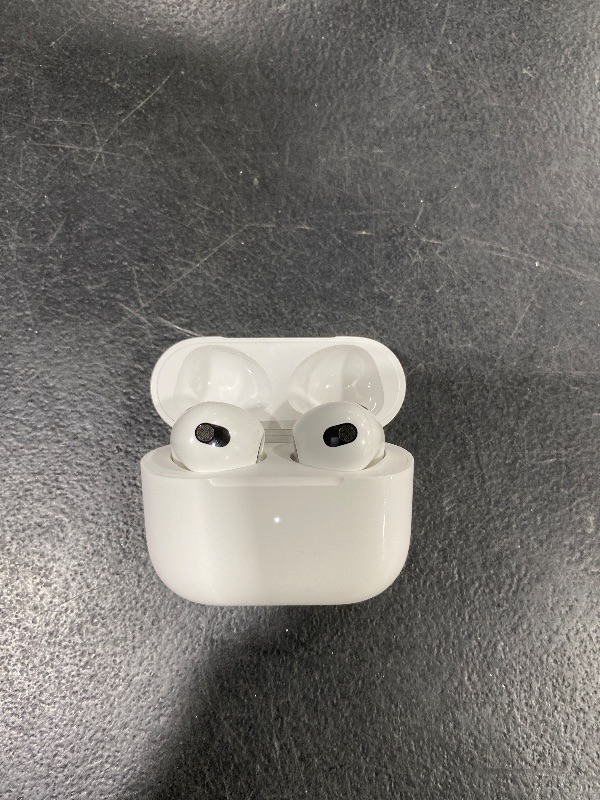 Photo 1 of Apple AirPods (3rd Generation) Wireless Ear Buds, Bluetooth Headphones, Personalized Spatial Audio, Sweat and Water Resistant, Lightning Charging Case Included, Up to 30 Hours of Battery Life