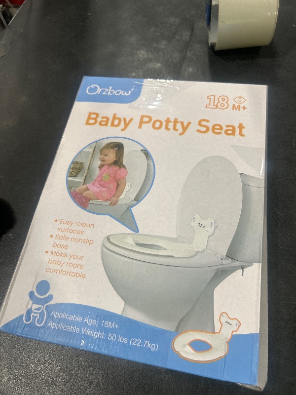 Photo 1 of Orzbow Foldable Potty Training Seat, Toddler Toilet Seat for Travel with Suction Cups | Firmly Adhere and Adjustable Length | Fits Most Adult Toilets, with Splash Guard, Easy to Clean, Ivory White