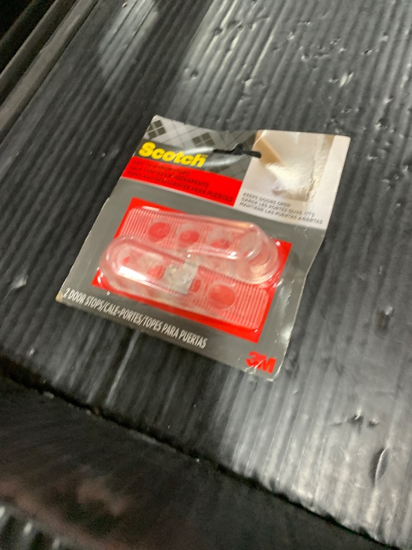 Photo 1 of Scotch Door Stoppers, 2 Count, 1-1/8 in., Flexible Material Assures Snug Fit Under Doors, Easy to Use Stops for Bottom of Door (SP947)