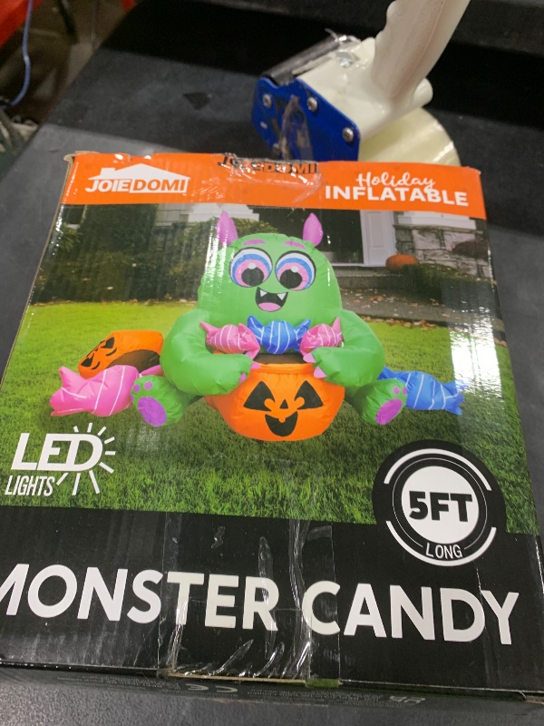 Photo 1 of Joiedomi 5 Ft Long Cute Halloween Inflatables Monster with Candies Outdoor Decorations, Blow Up Monster with Build-in LEDs Halloween Inflatables for Indoor, Outdoor, Yard, Garden, Lawn Decorations