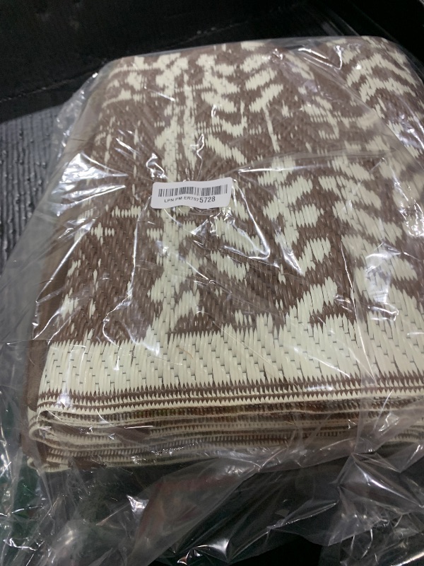 Photo 1 of MontVoo Outdoor Rug Waterproof-Patio Rug Mat 5x8 Outdoor Carpet Reversible RV Camping Picnic Plastic Straw Rug Outside Outdoor Area Rug for Balcony Deck Backyard Patio Decor Boho Modern-Brown
