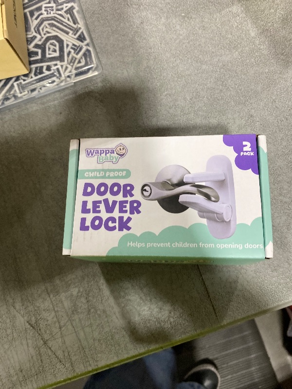 Photo 1 of Door Lever Lock (2 Pack) – Prevents Toddlers from Opening Doors – Easy One-Hand Operation for Adults – Durable ABS with 3M Adhesive Backing – No Tools Needed for Install