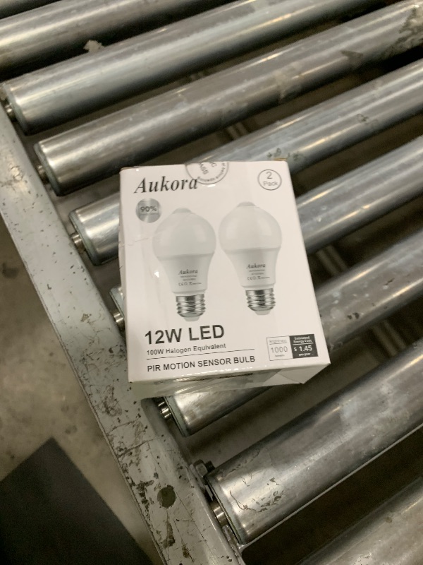 Photo 1 of Aukora Motion Sensor Light Bulbs, 12W (100-Watt Equivalent) E26 Motion Activated Dusk to Dawn Security Bulb Outdoor/Indoor for Front Door Porch Garage Basement Hallway Closet(Cold White 2 Pack)
