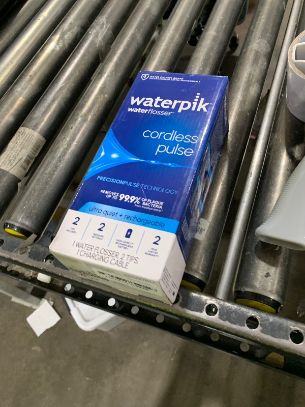 Photo 1 of Waterpik Cordless Pulse Rechargeable Portable Water Flosser for Teeth, Gums, Braces Care and Travel with 2 Flossing Tips, Waterproof, ADA Accepted, WF-20 White, Packaging May Vary