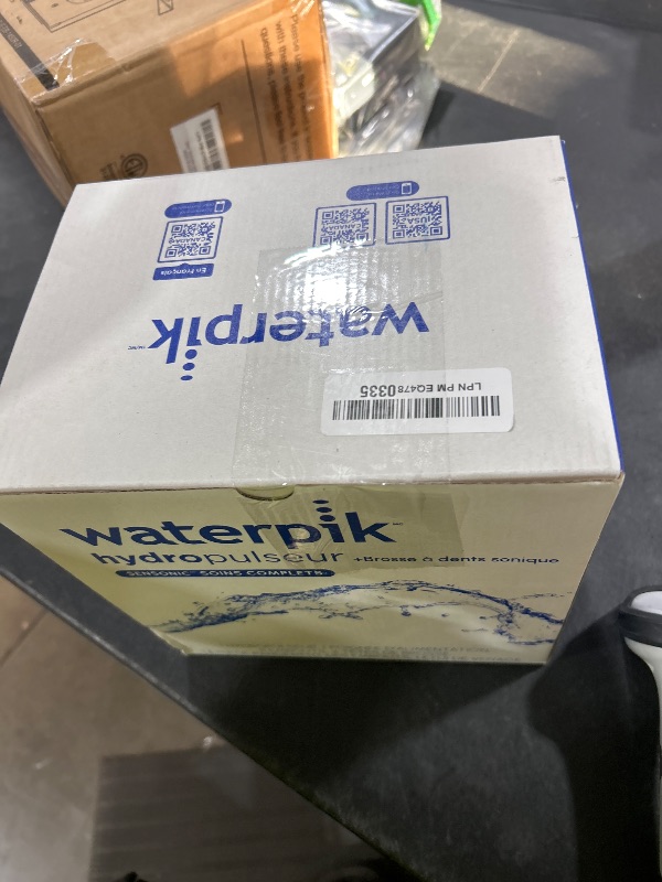 Photo 1 of Waterpik Sensonic Complete Care Water Flosser and Rechargeable Electric Toothbrush Combo Set for Teeth Cleaning and Flossing, CC-04, White, Packaging May Vary