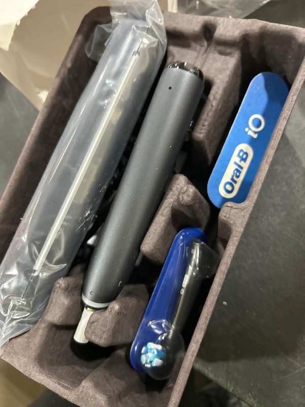 Photo 1 of Oral-B iO Deep Clean + Protect Rechargeable Electric Toothbrush, White with a iO Series 7 Toothbrush, 2 Replacement Brush Heads, and a Charging Travel Case