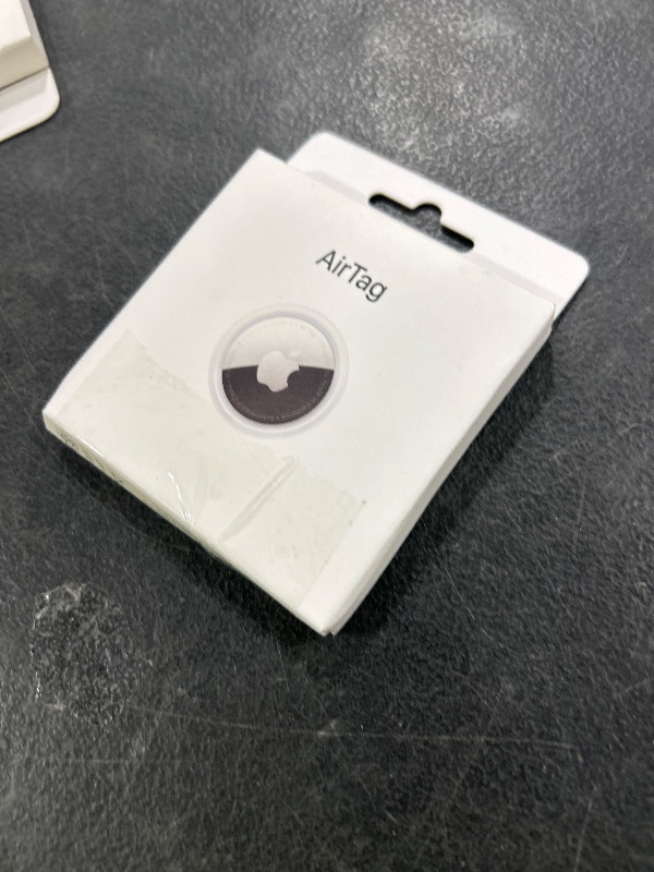 Photo 1 of Apple AirTag. Keep Track of and find Your Keys, Wallet, Luggage, Backpack, and More. Simple one-tap Set up with iPhone or iPad