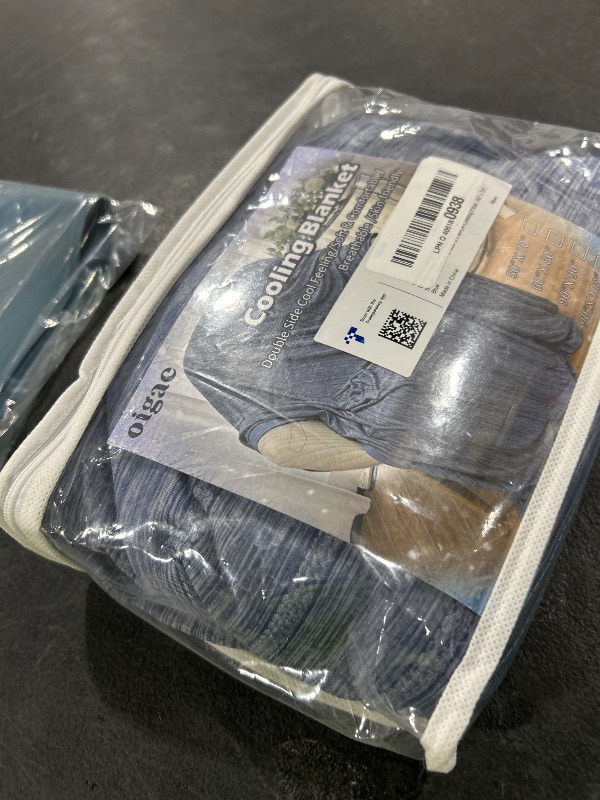 Photo 1 of OIGAE Cooling Blanket for Hot Sleepers - Soft & Lightweight Summer Cold Blanket for Night Sweats | Perfect for Bed, Couch, Sofa (Dark Blue, Throw 50" x 70")
