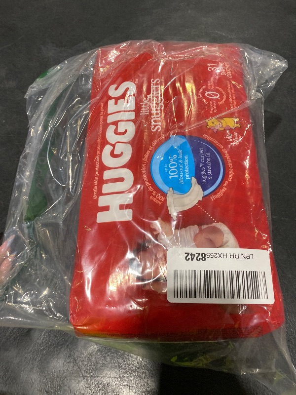 Photo 1 of Huggies Size Newborn Diapers, Little Snugglers Baby Diapers, Size Newborn (up to 10 lbs), 31 Count, Packaging May Vary