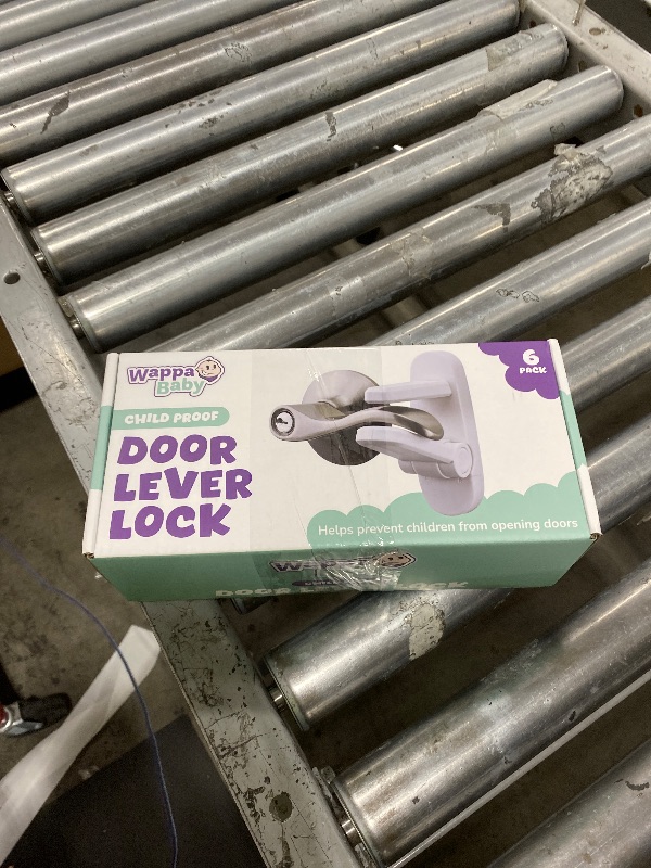 Photo 1 of Door Lever Lock (6 Pack) Prevents Toddlers from Opening Doors. 3.25" L * 1.5" W * 4.5" H Easy One Hand Operation for Adults. Durable ABS with 3M Adhesive Backing. Simple Install, No Tools Needed.